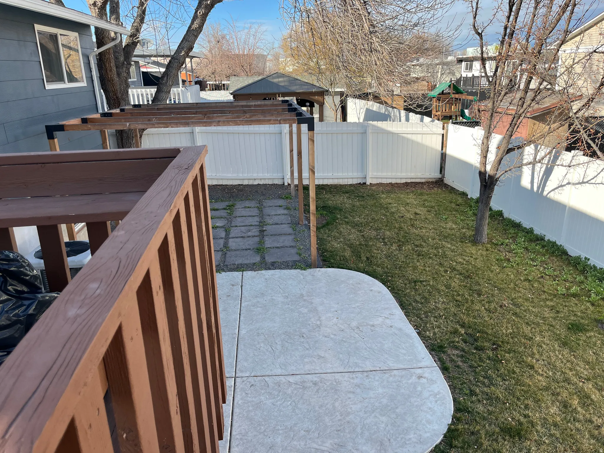 Fenced backyard with a patio and a residential view