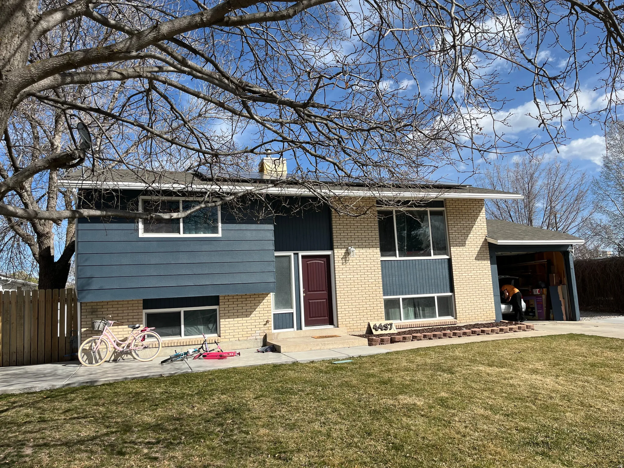 Bi-level home with brick siding and a garage