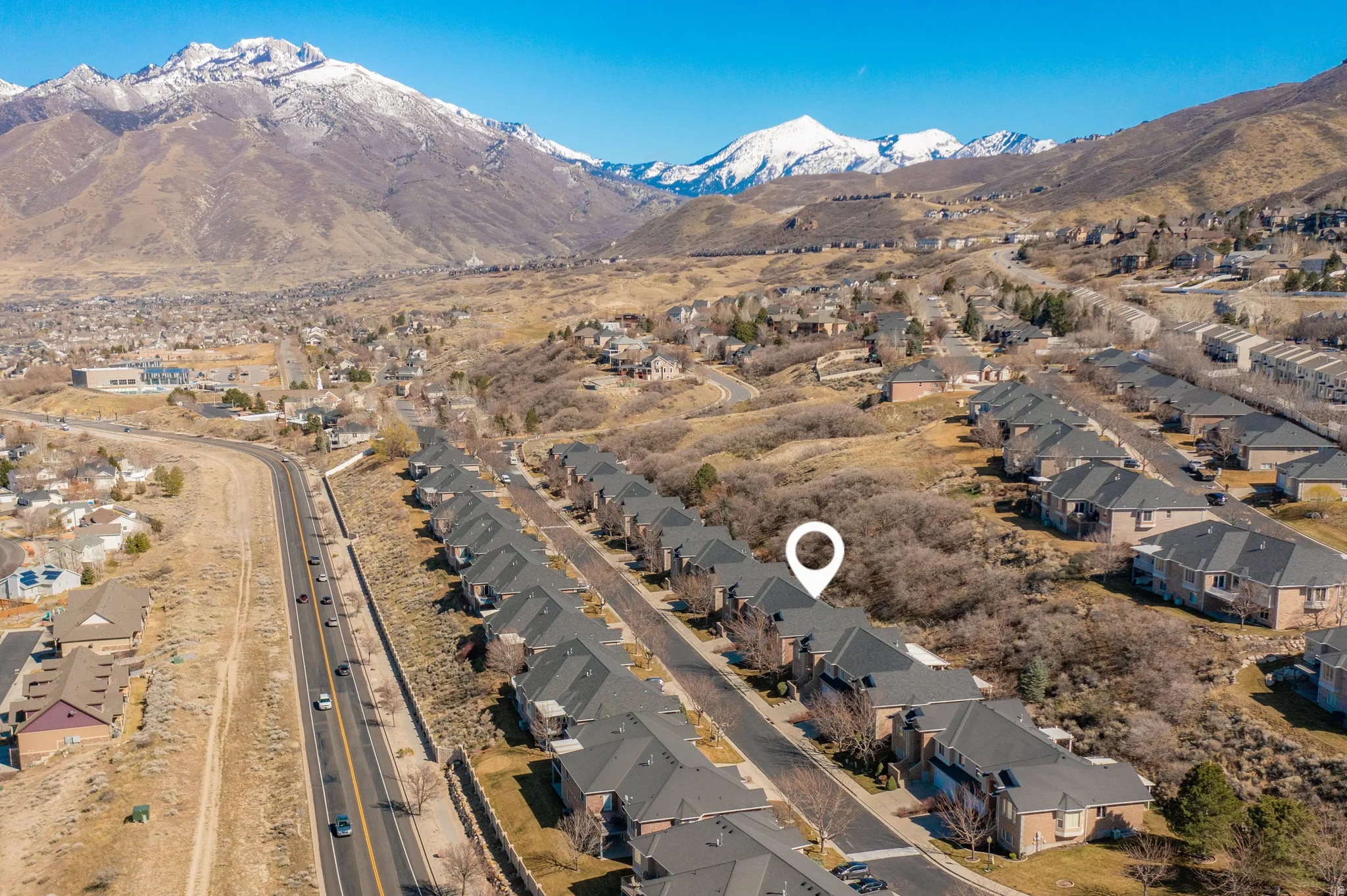 Aerial view of residential area featuring mountains
