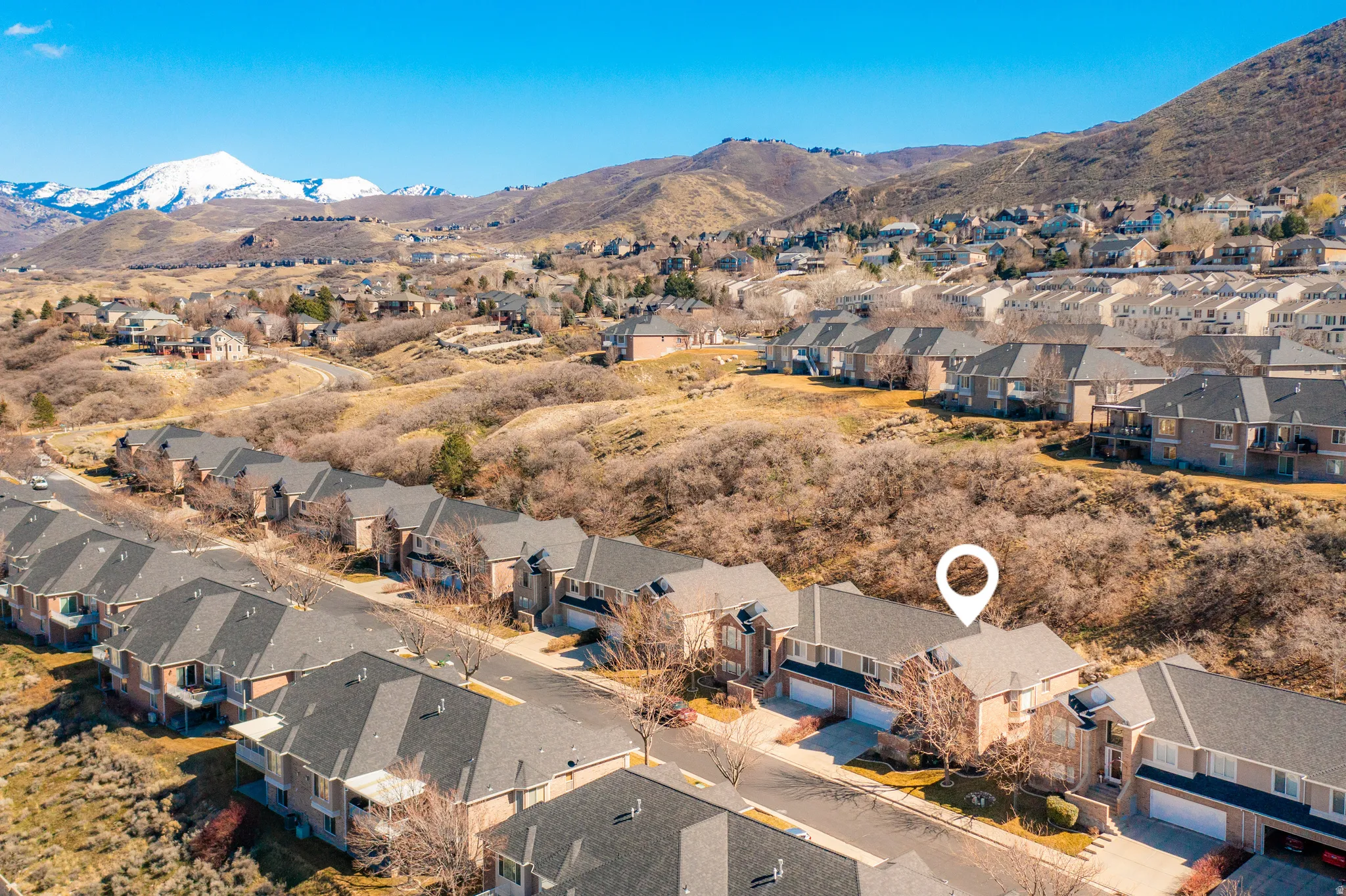 Aerial view of residential area with a mountain backdrop