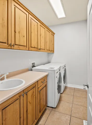 Laundry area with sink and lots of cabinet space