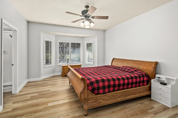 Bedroom featuring light wood-type flooring and ceiling fan