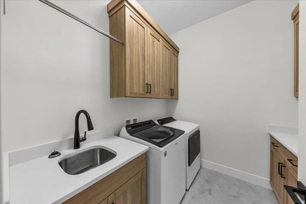 Laundry area with washer and dryer and cabinet space