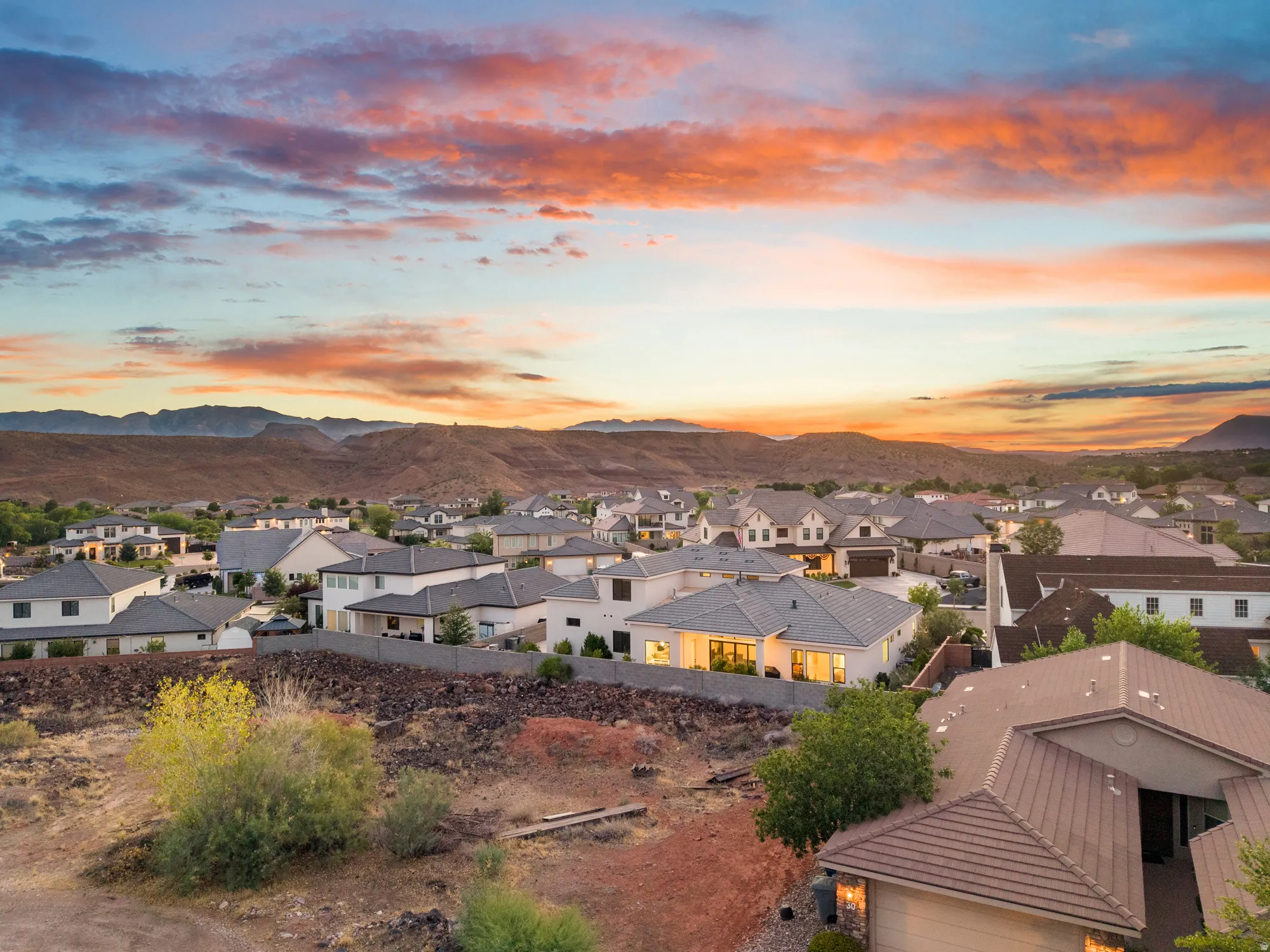 Residential community nestled against a mountainous backdrop