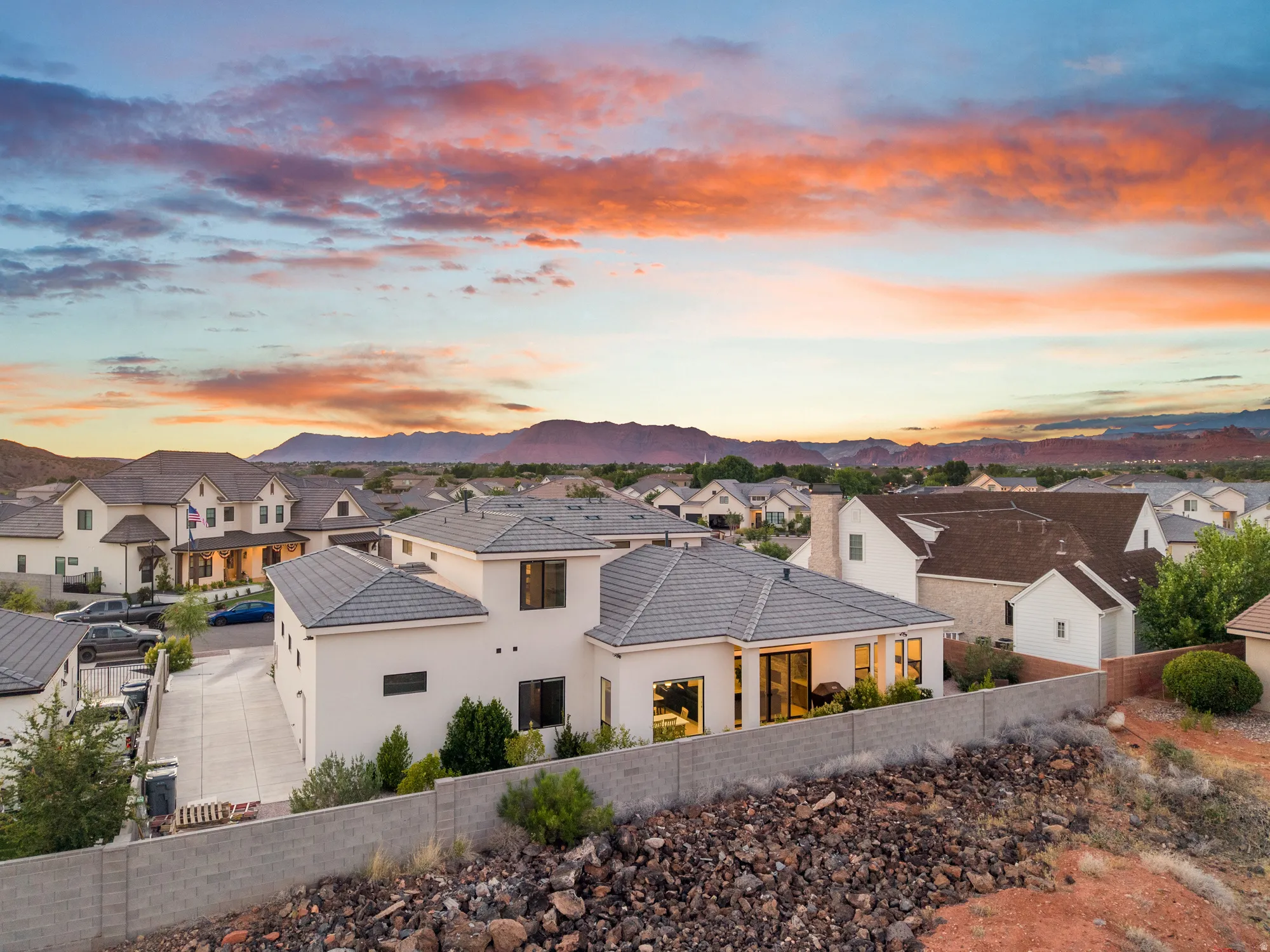 Modern stucco residence with a multi-level design and tiled roof