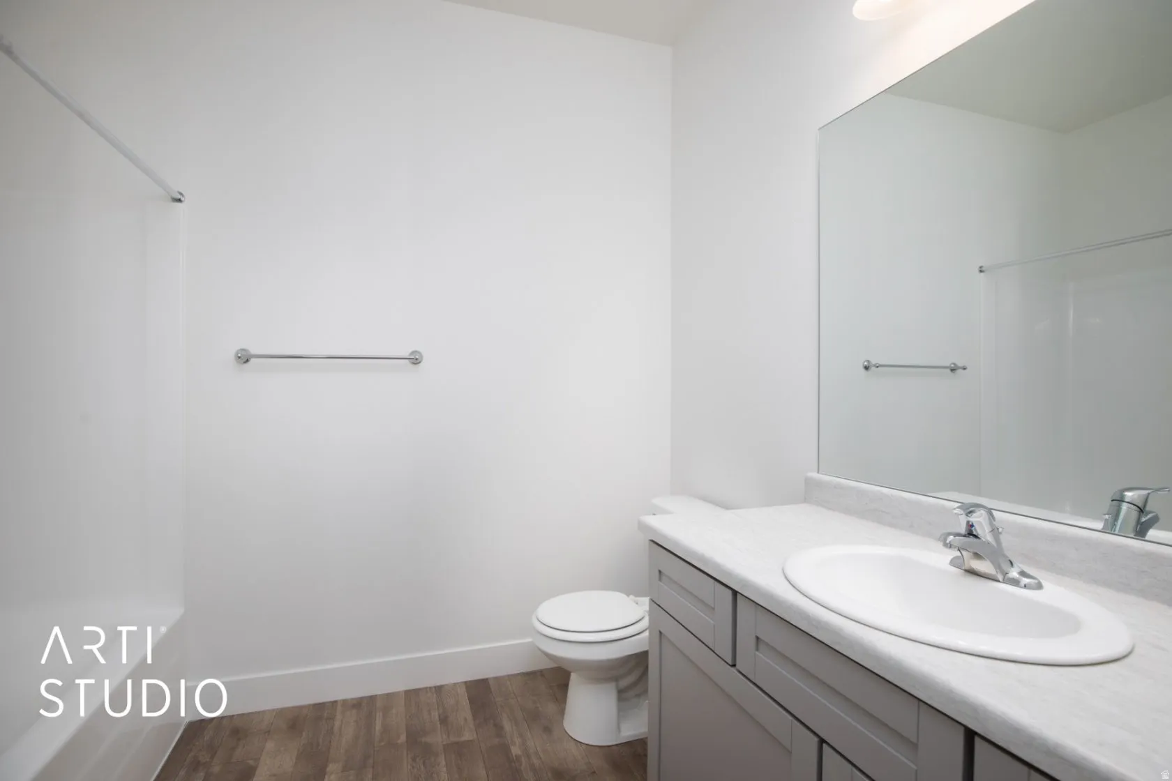 Full bath with vanity, dark wood-style flooring, and bathing tub / shower combination