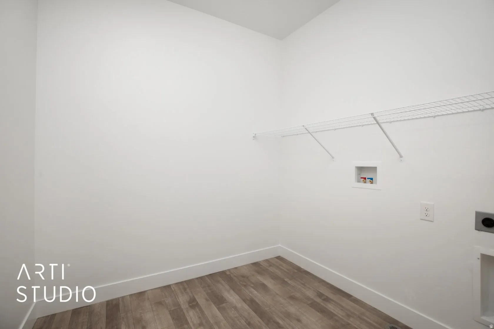 Laundry area with light wood-style floors, electric dryer hookup, and washer hookup