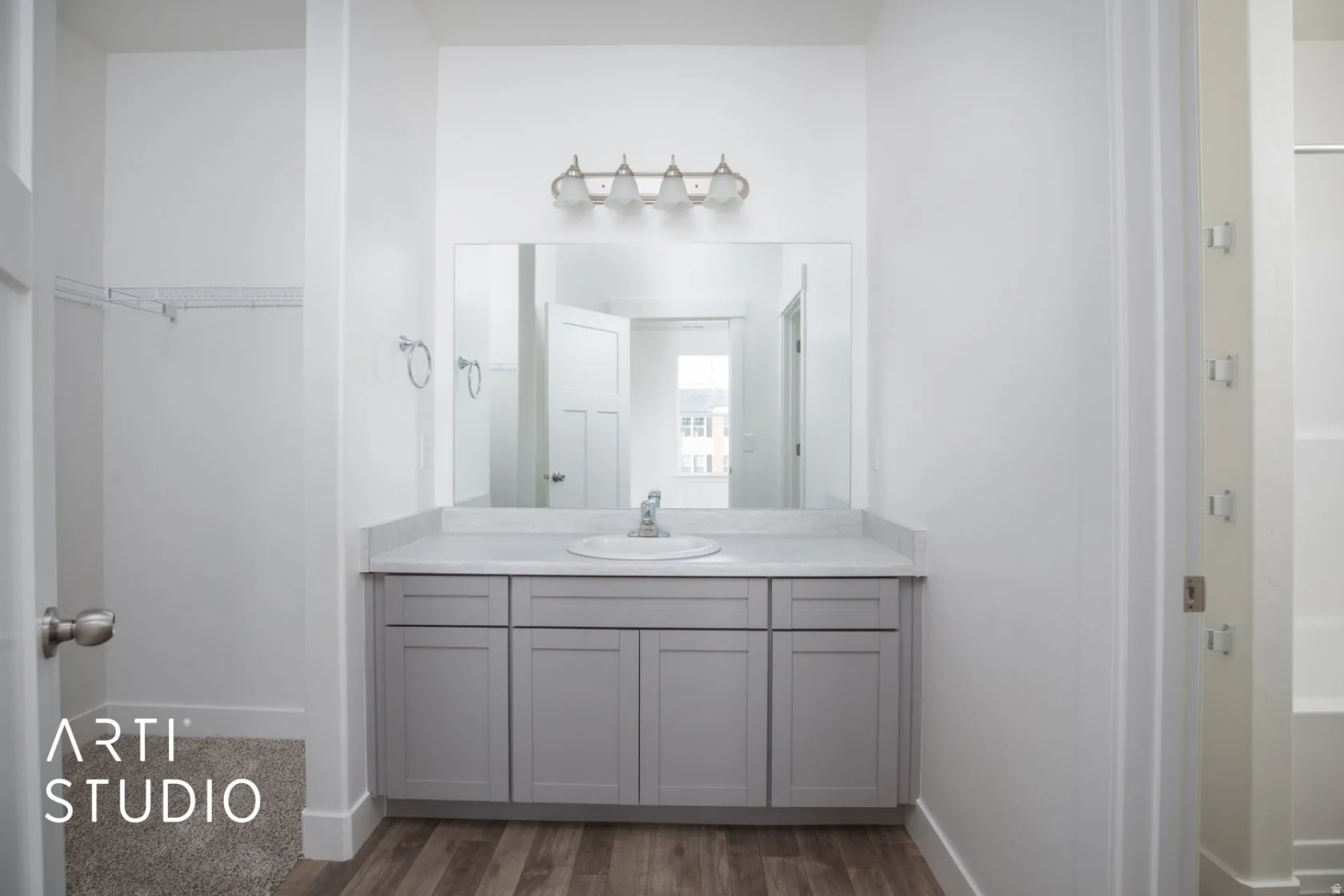 Bathroom featuring vanity and dark wood finished floors