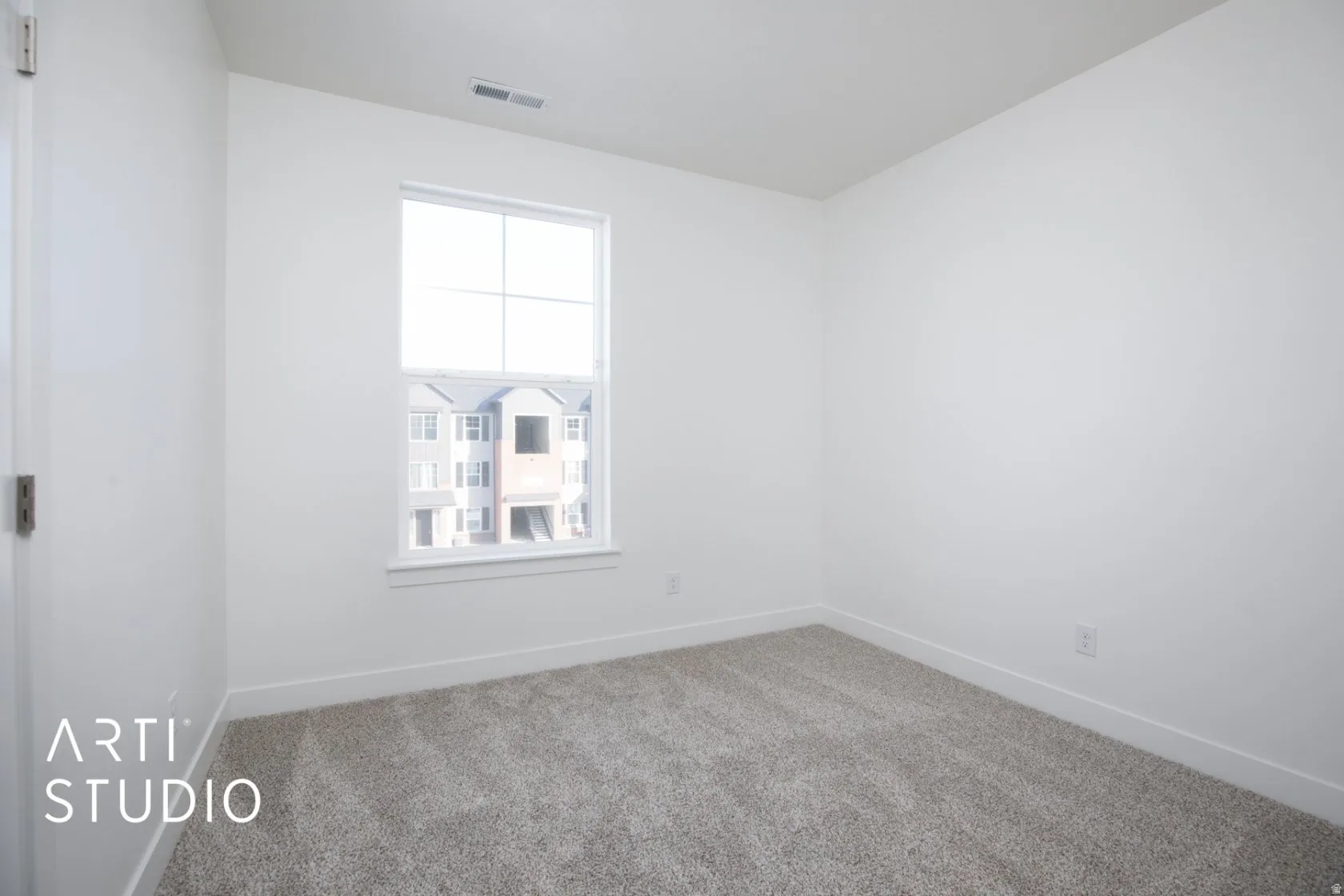 Spare room with carpet floors and baseboards