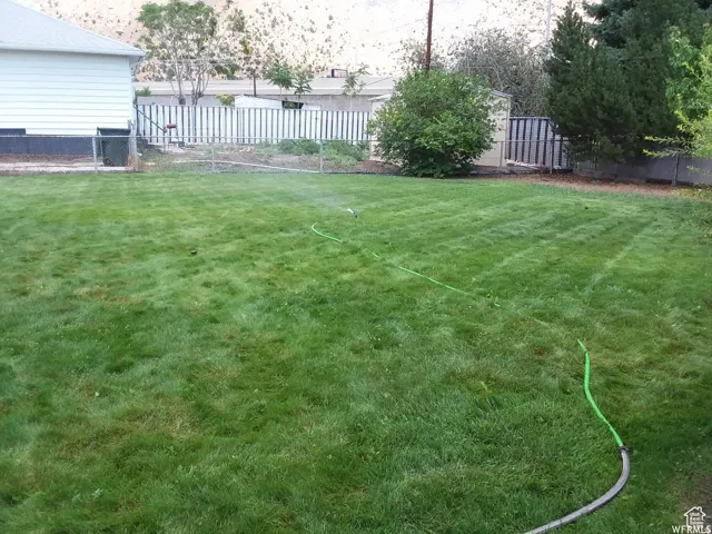 View of fenced backyard