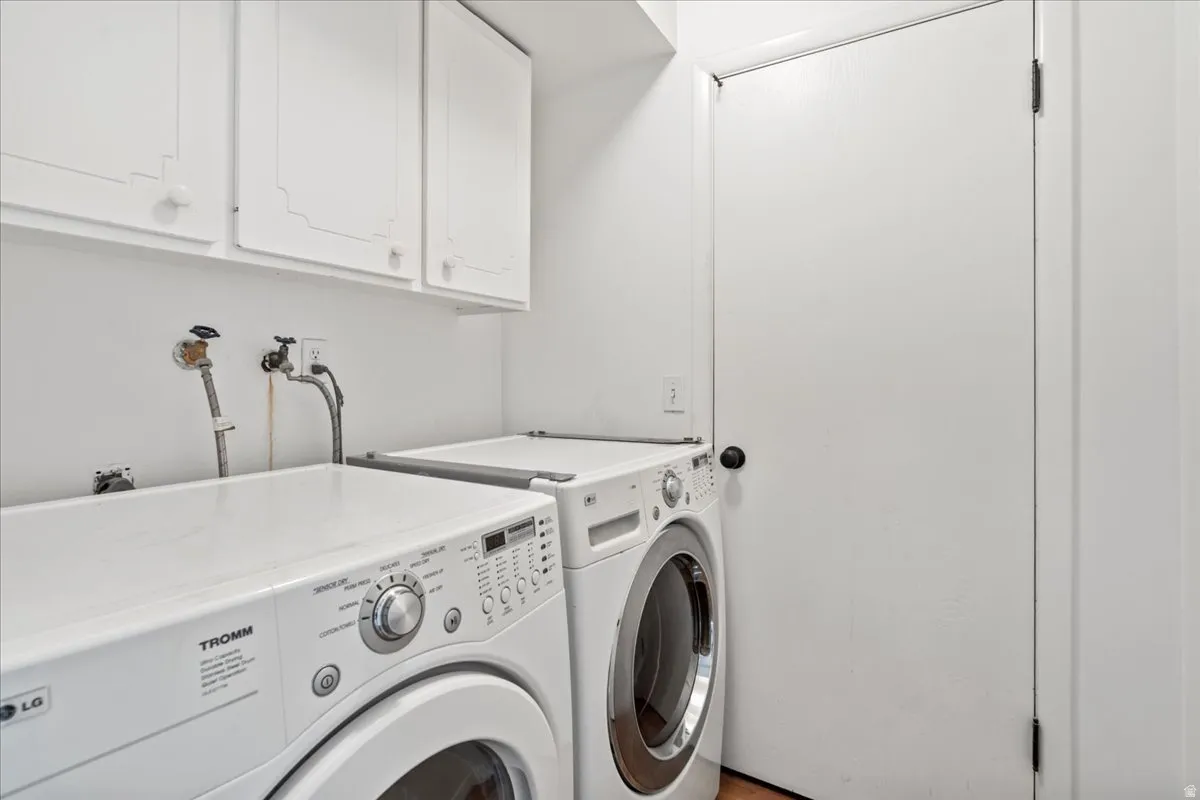 Laundry area with cabinet space and washer and dryer
