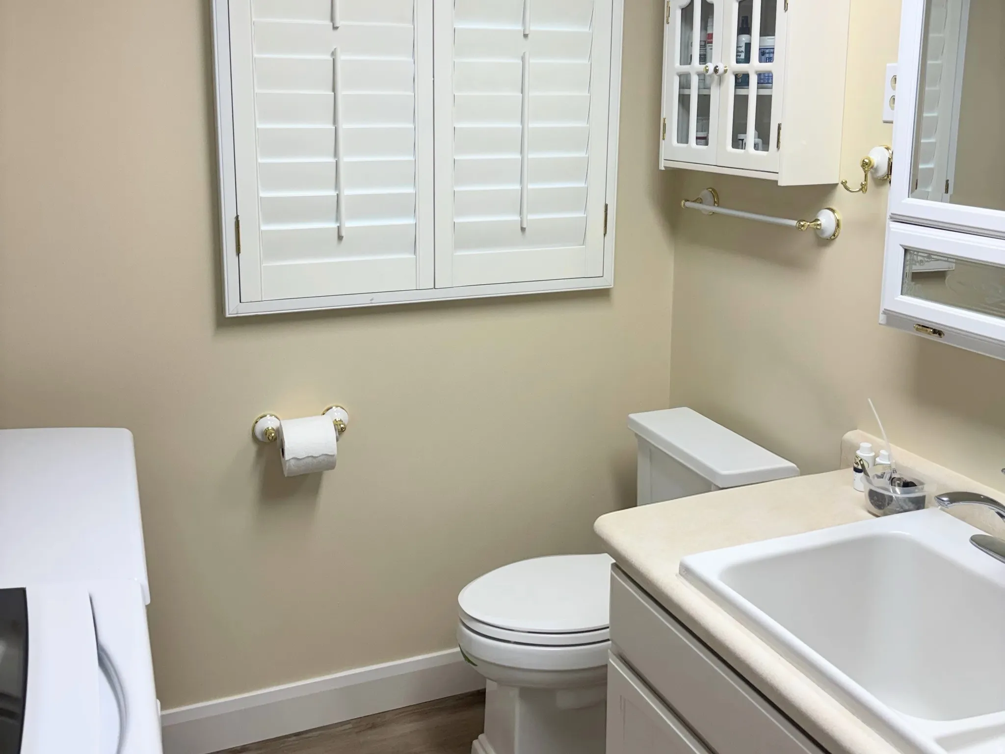 Bathroom off of Kitchen with Laundry Room