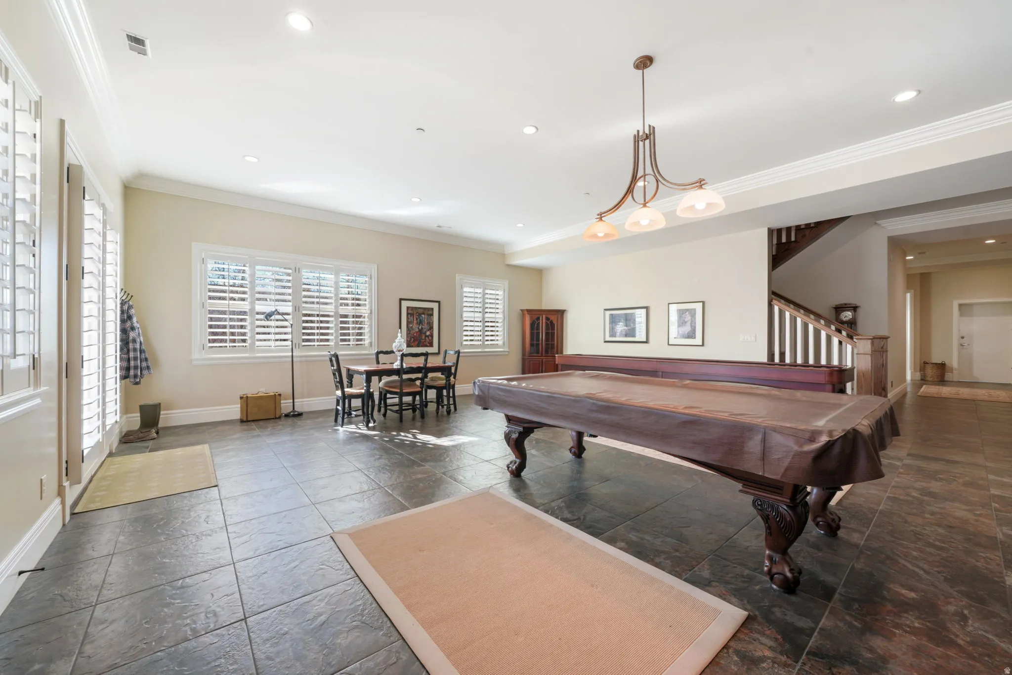 Recreation room with recessed lighting, billiards table, crown molding, and stone tile floors