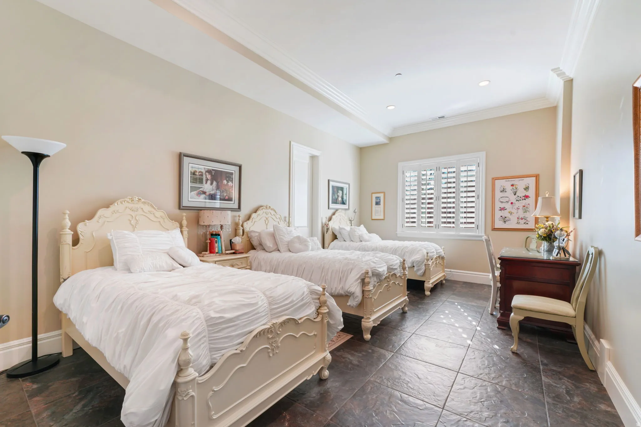 Bedroom featuring ornamental molding, stone tile floors, and recessed lighting