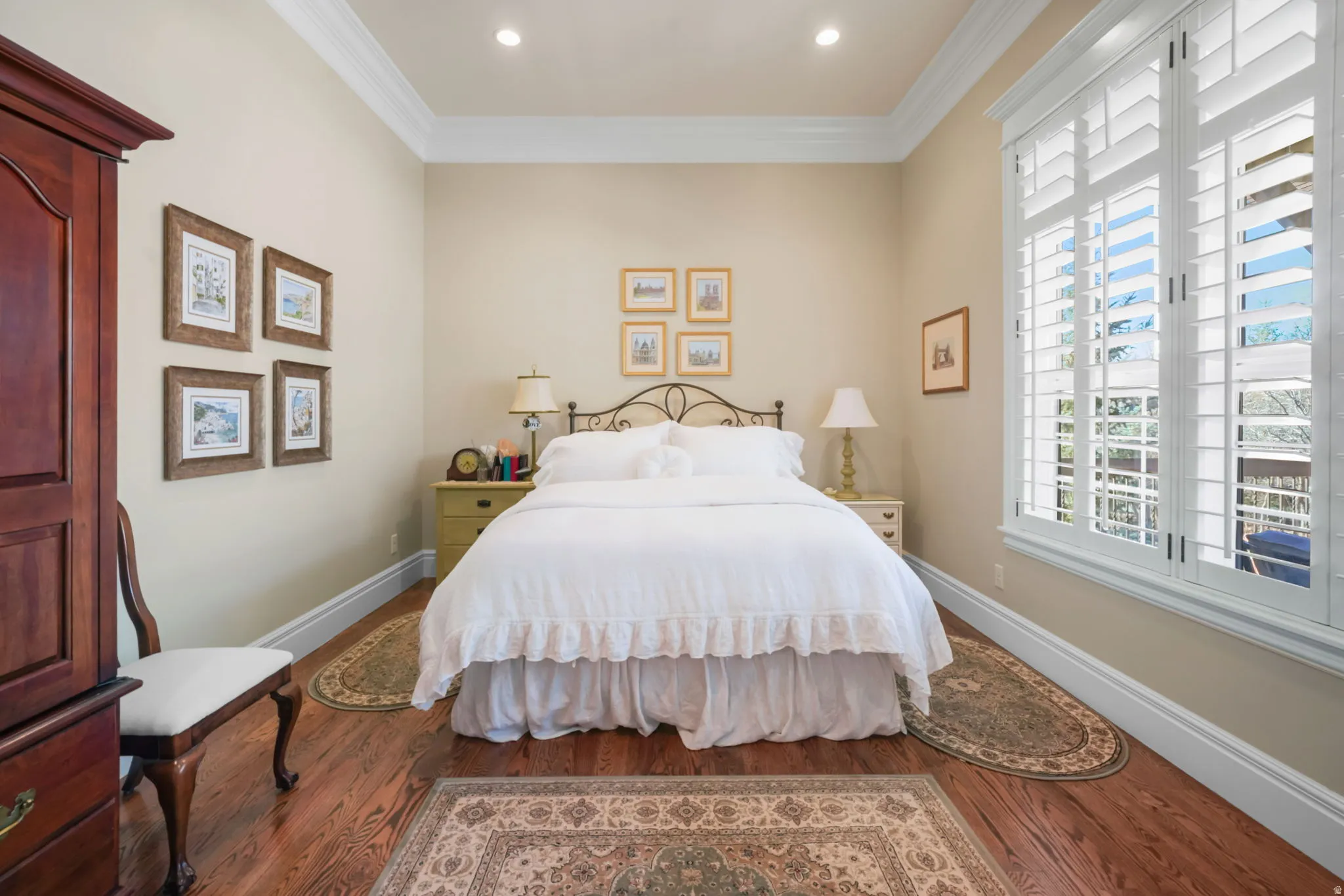 Bedroom with crown molding, dark wood finished floors, and recessed lighting