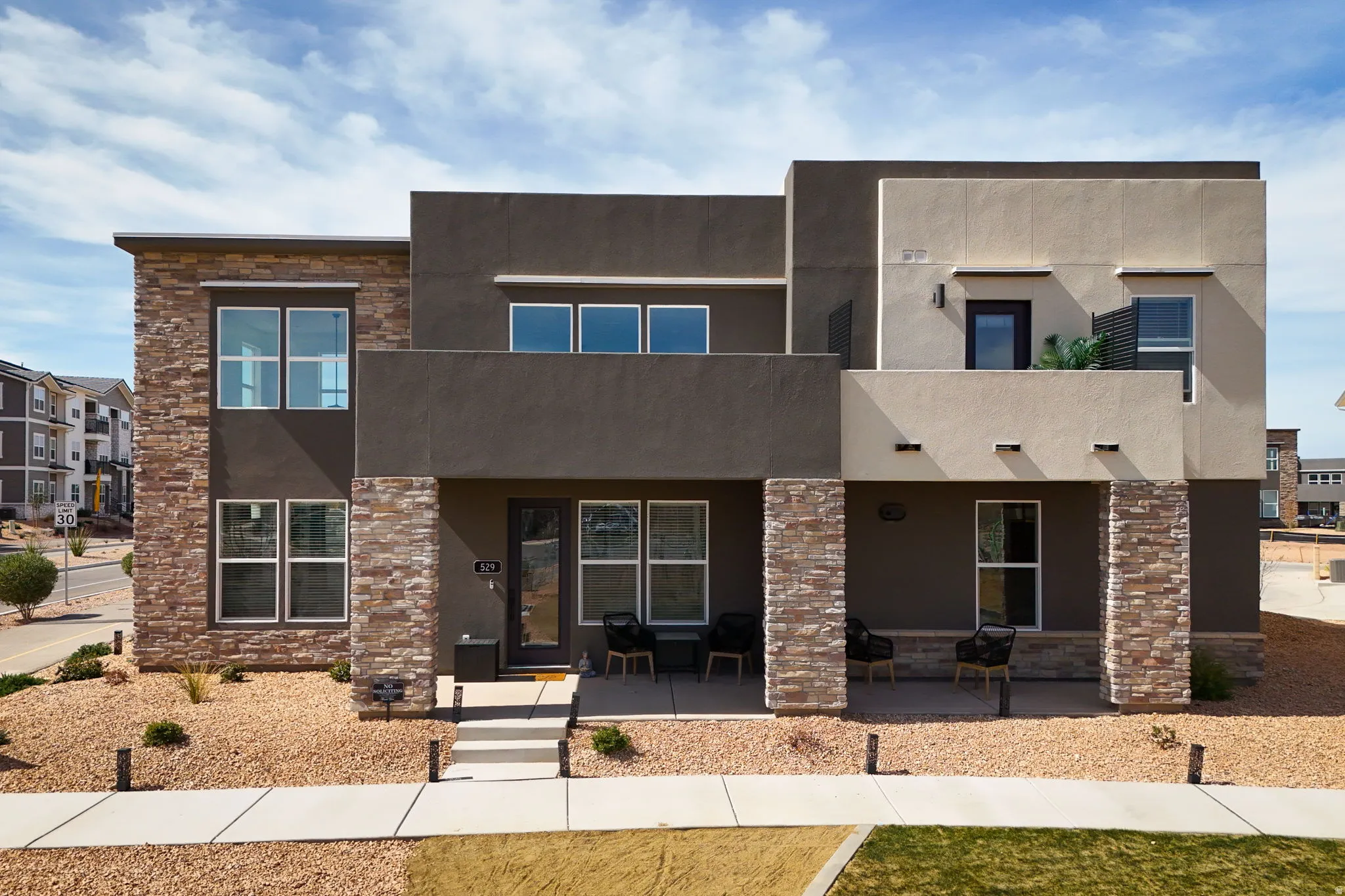 Contemporary house with stone siding and stucco siding