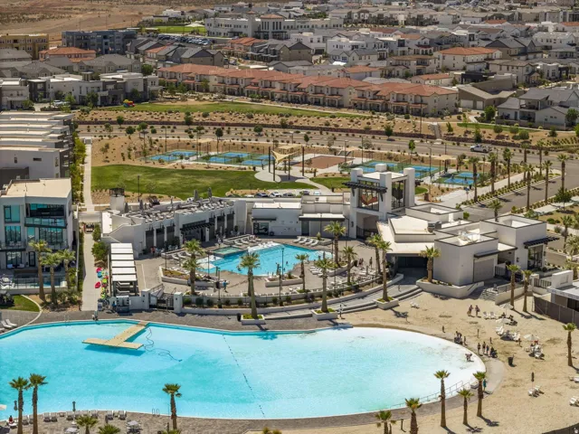 Community pool with a residential view
