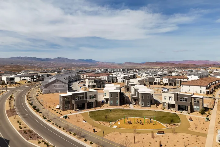 Aerial view of residential area featuring a mountain backdrop