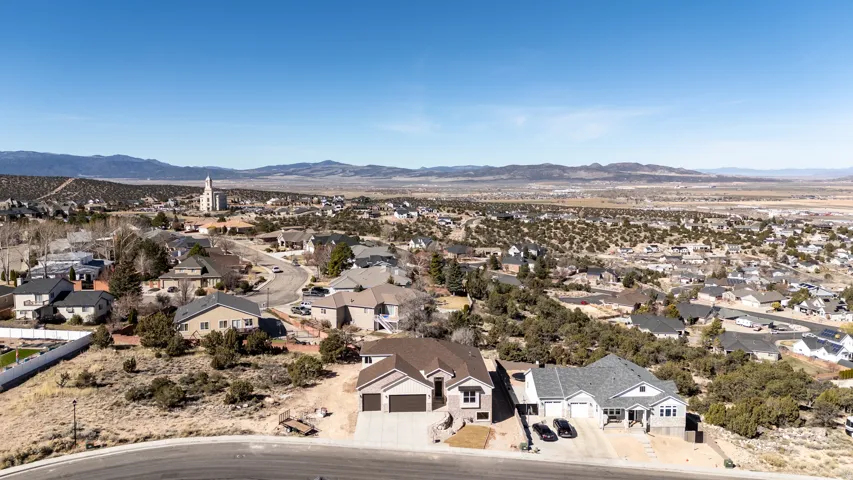 Aerial view of residential area featuring mountains