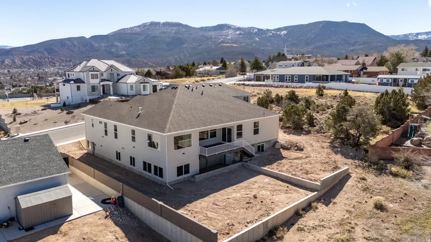 Aerial view of residential area with a mountainous background