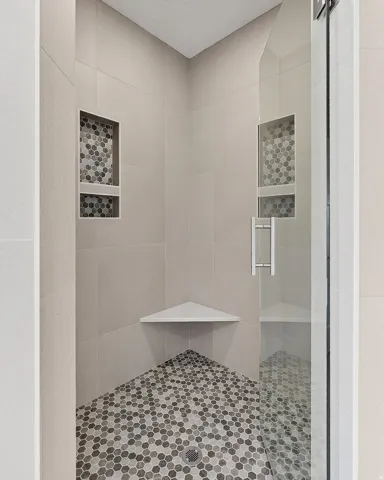 Full bathroom featuring a stall shower
