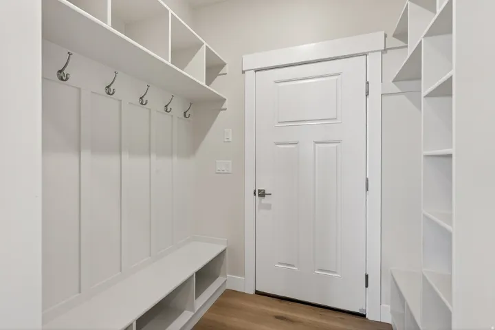 Mudroom featuring light wood-style floors