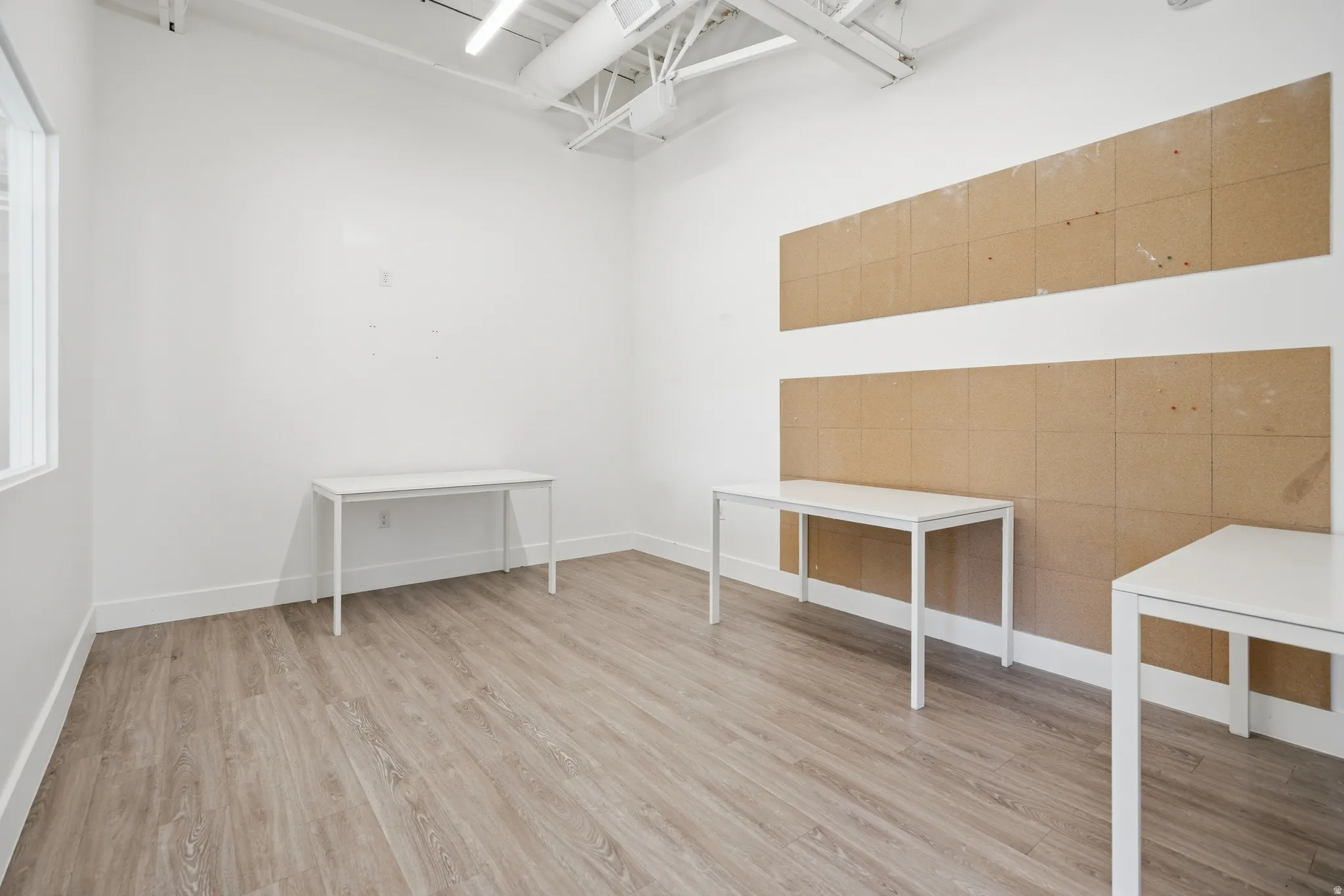 Walk in closet featuring light wood-type flooring