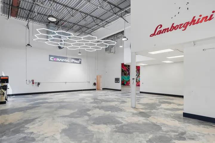 Garage featuring baseboards