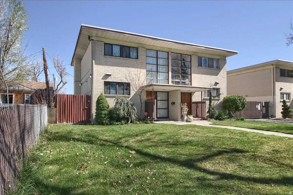 View of front of property with brick siding