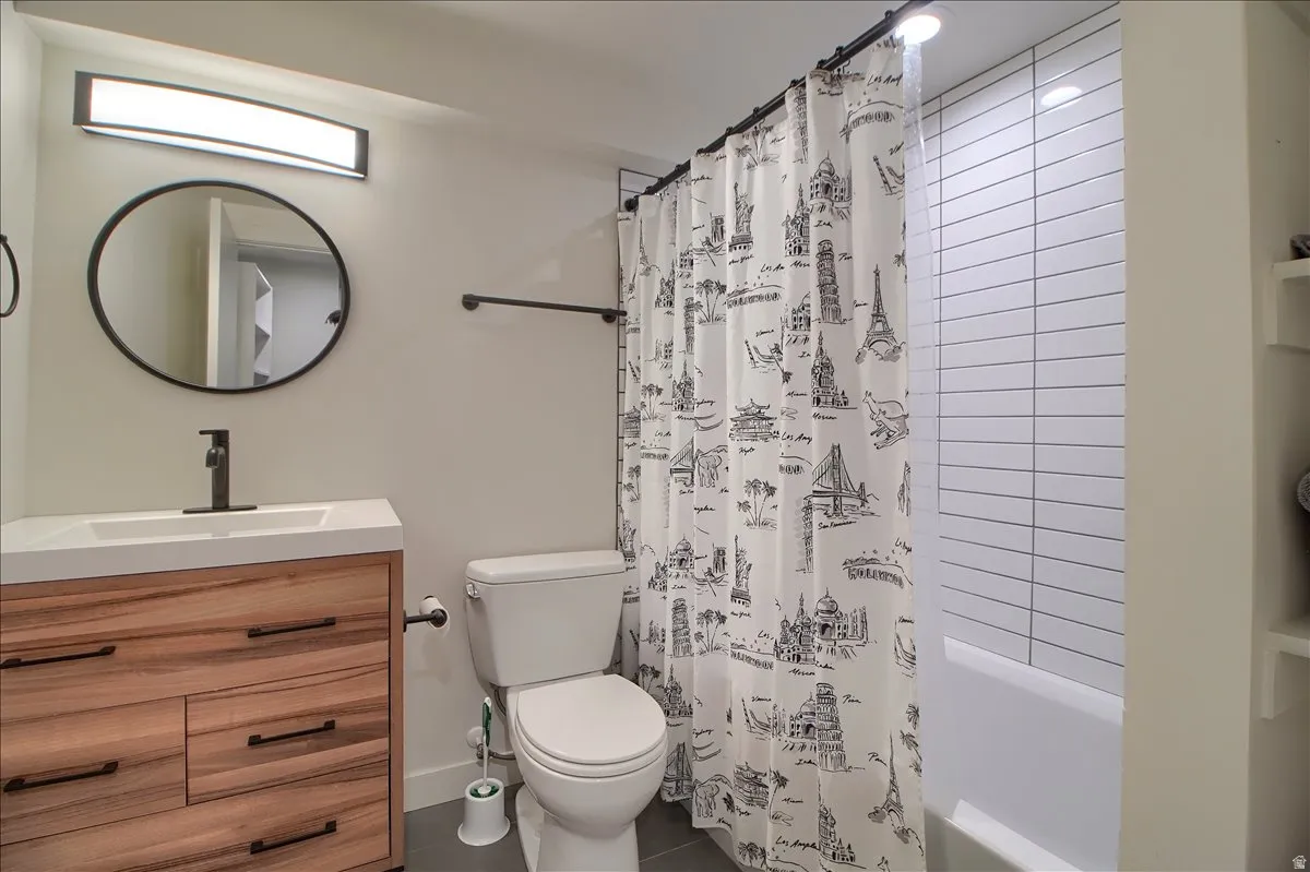 Full bathroom with vanity and shower / tub combo