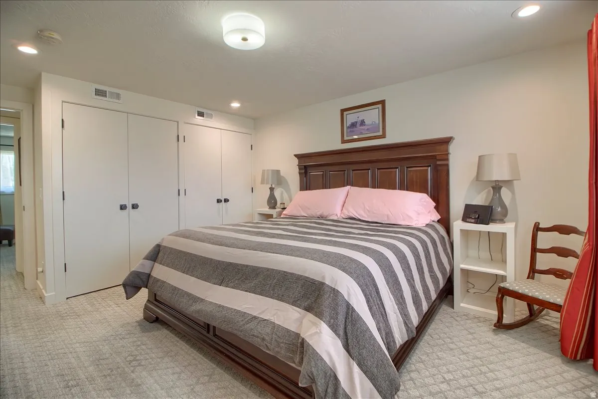 Bedroom with two custom closets.