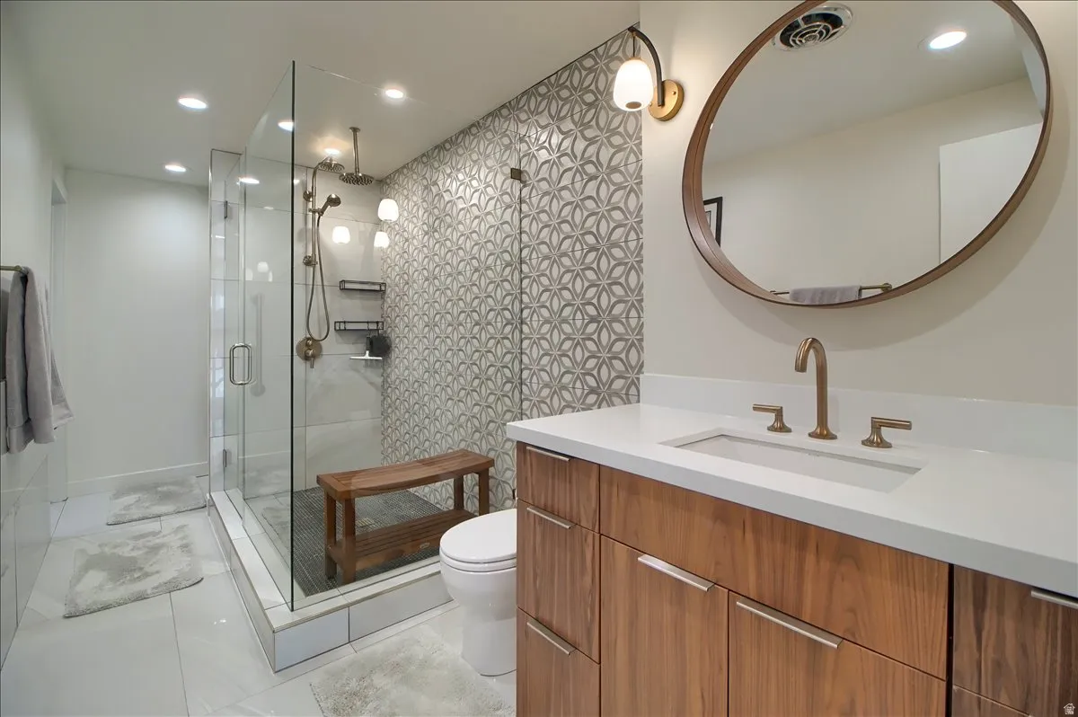 3/4 Bathroom featuring a custom  vanity, a large shower stall, and recessed lighting