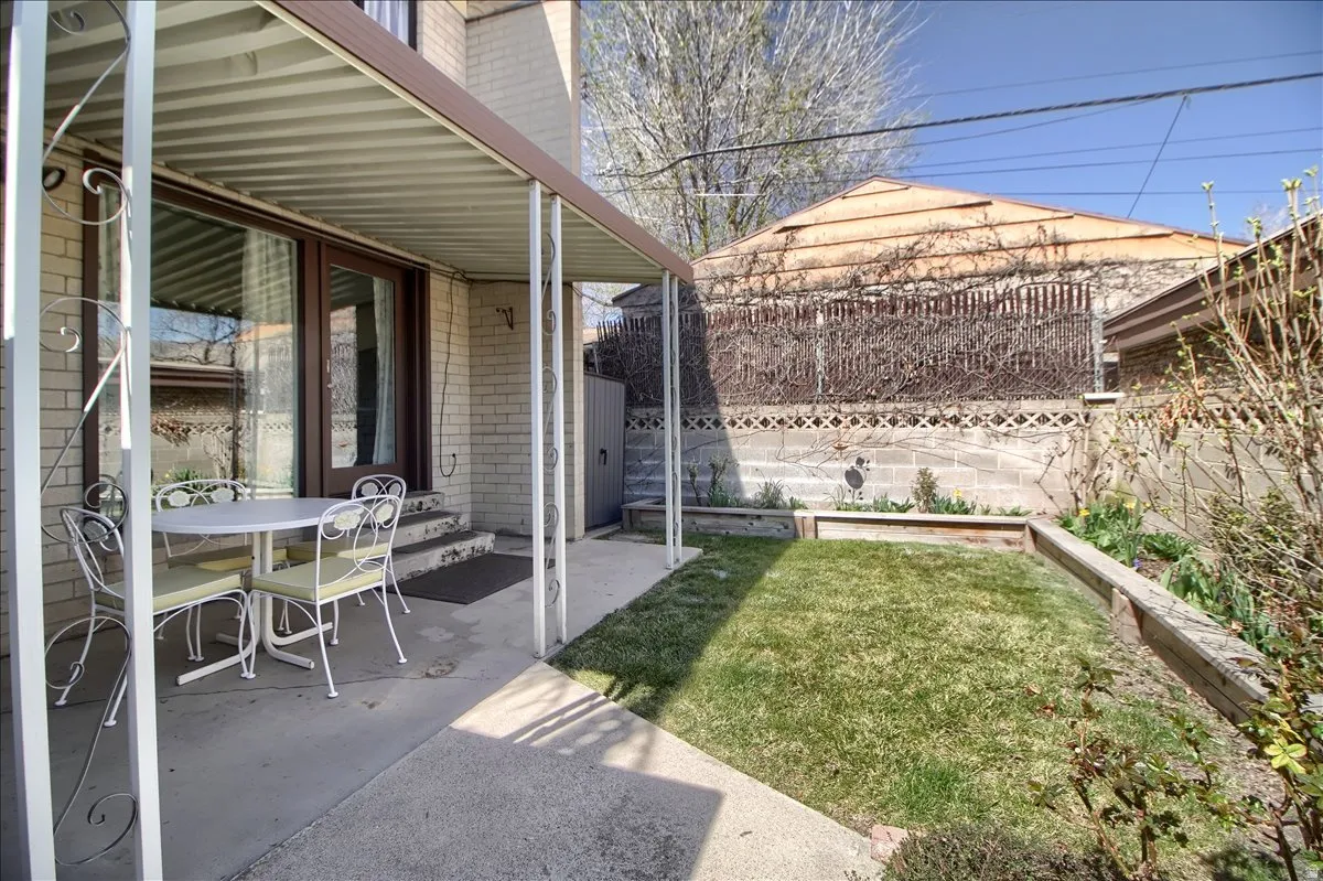 Fenced backyard featuring a patio area and outdoor dining space