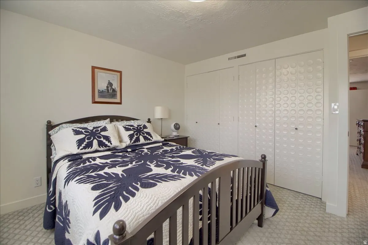 Bedroom with Original mid-century closet doors.