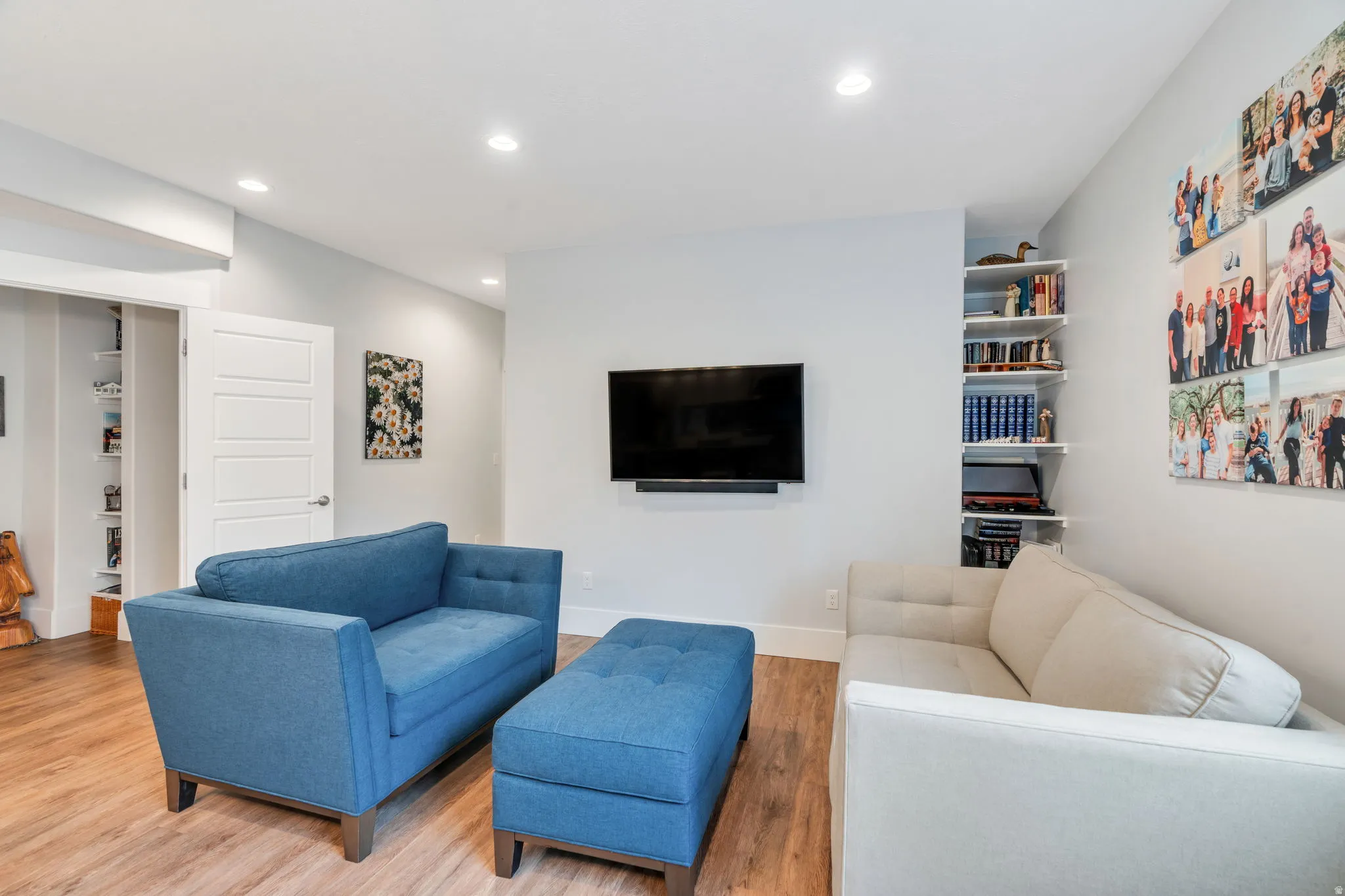 Living area featuring wood finished floors and recessed lighting