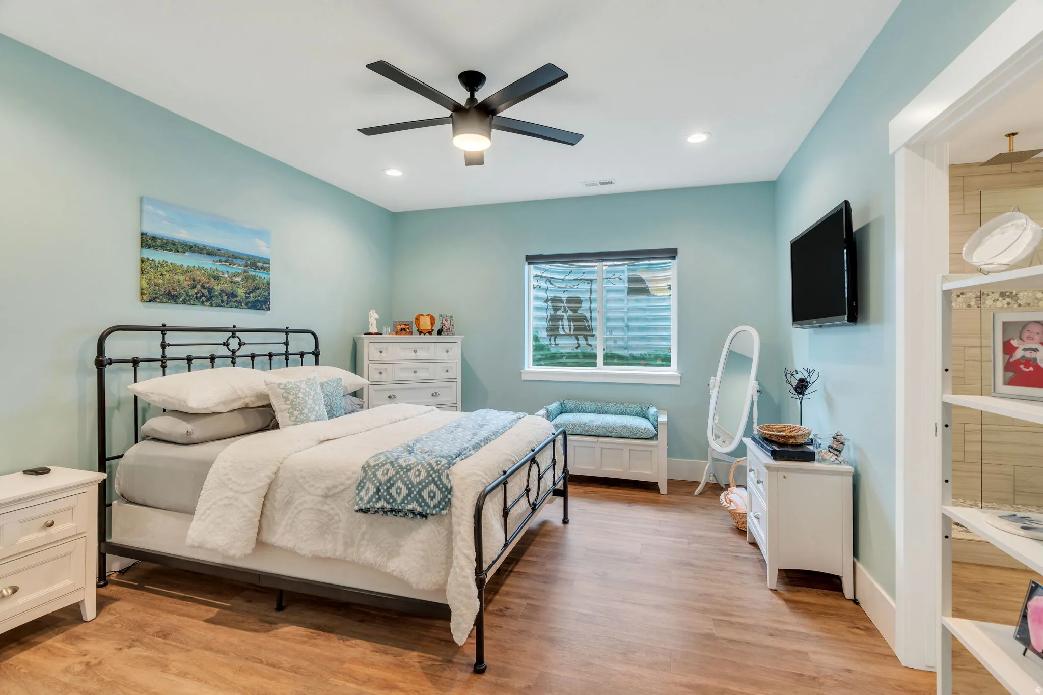 Bedroom with light wood-type flooring, a ceiling fan, and recessed lighting