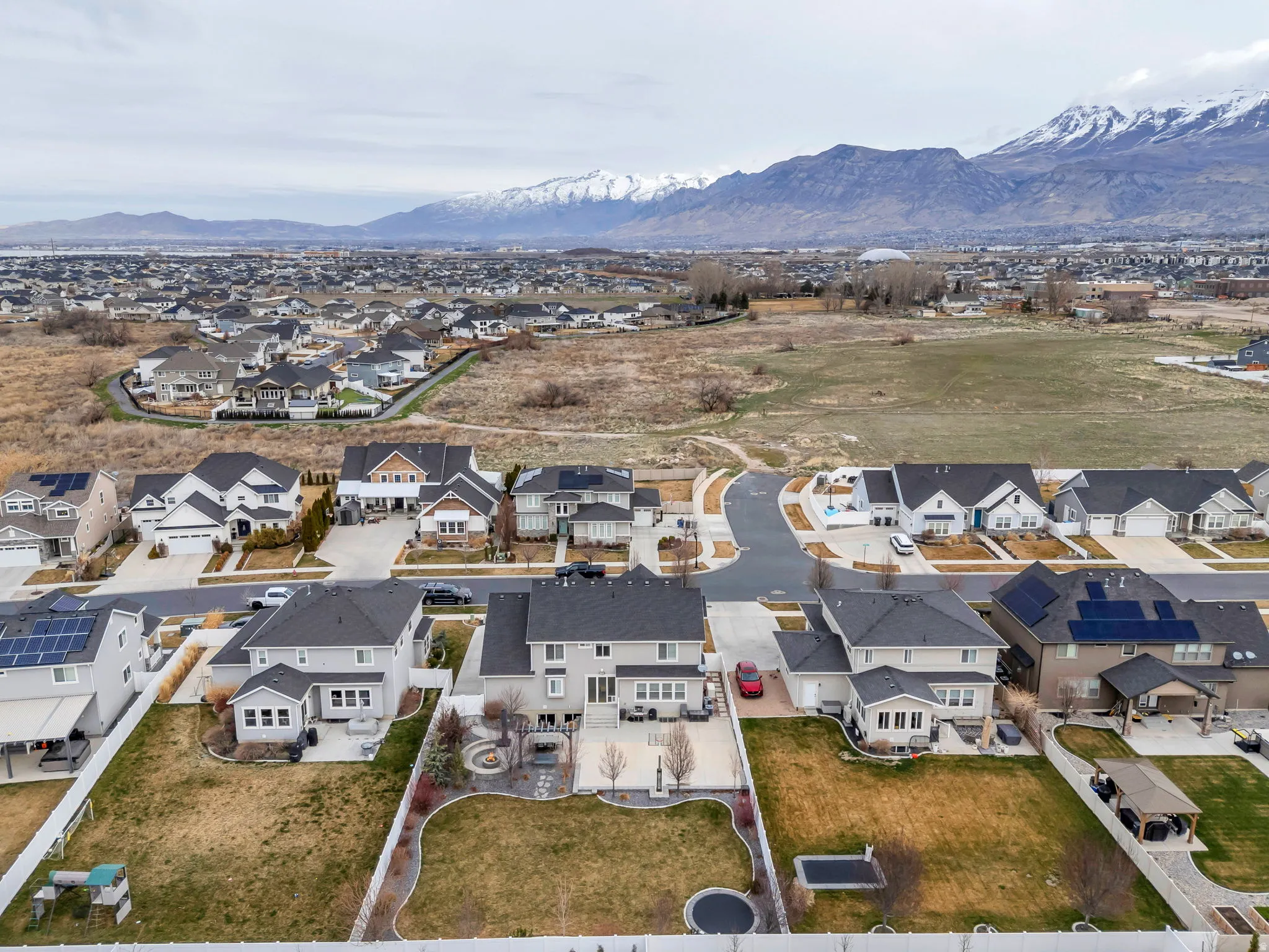 Aerial view of residential area featuring mountains