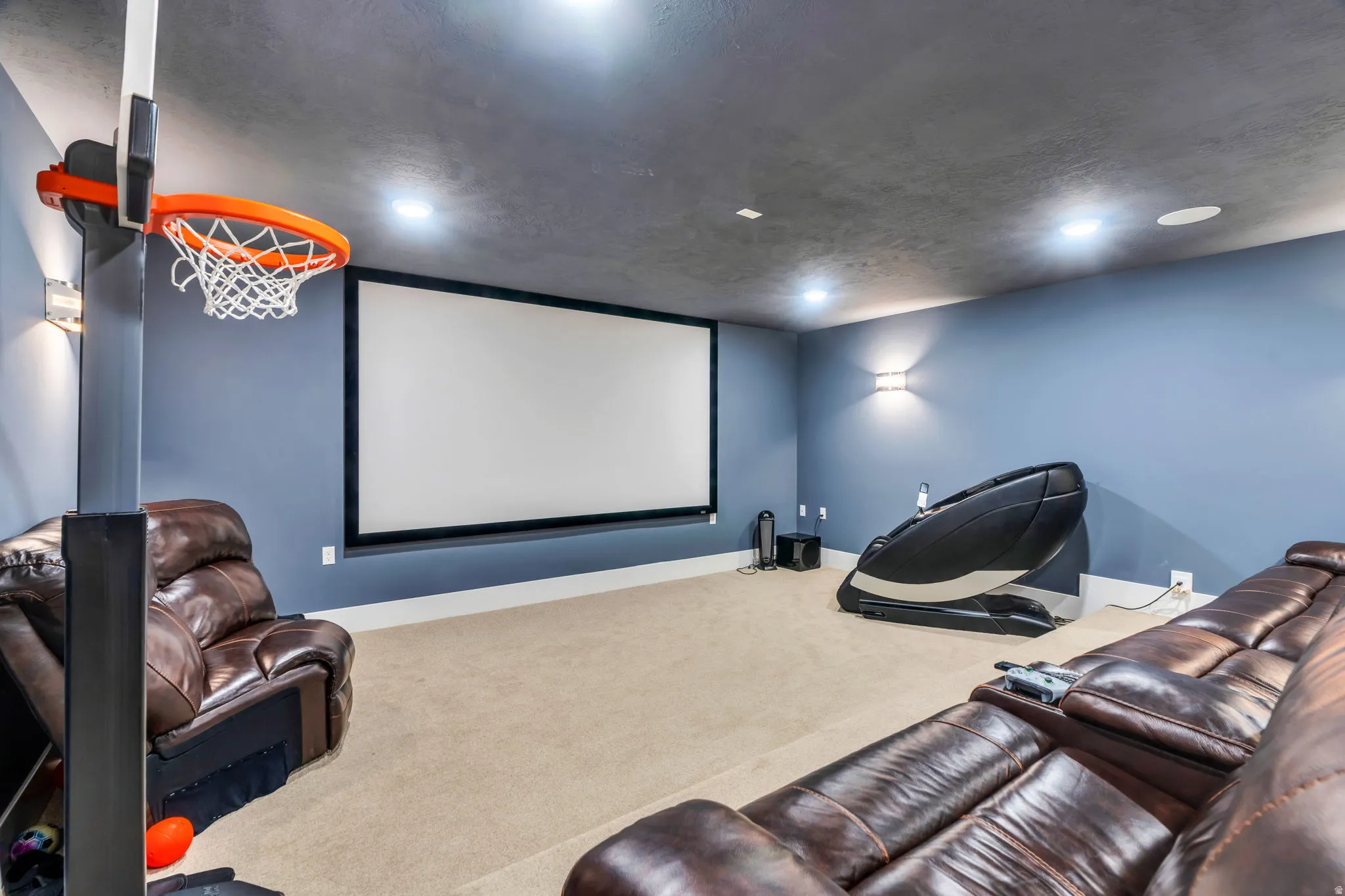 Cinema room with carpet floors and recessed lighting