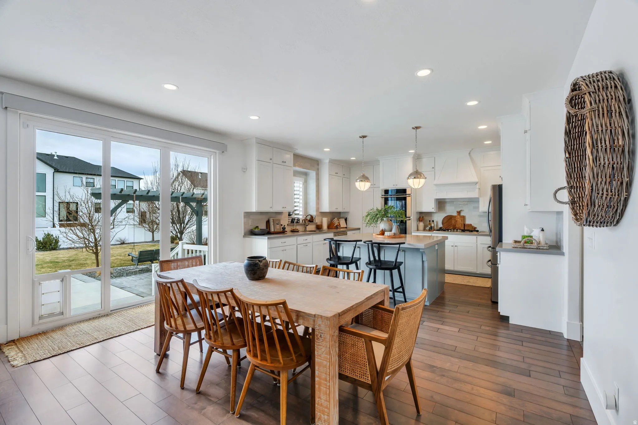 Dining area featuring dark wood finished floors and recessed lighting