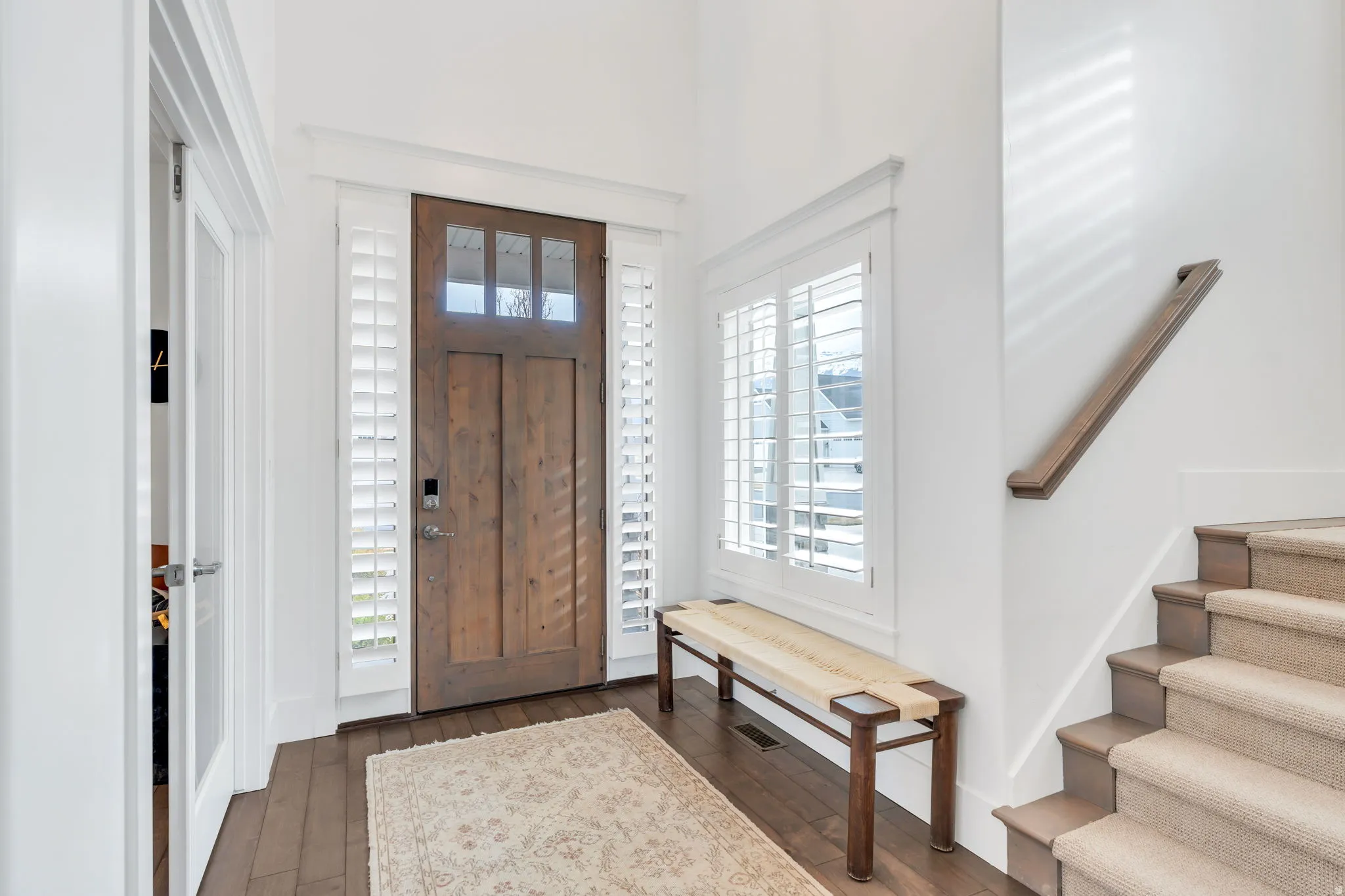 Entrance foyer with dark wood finished floors