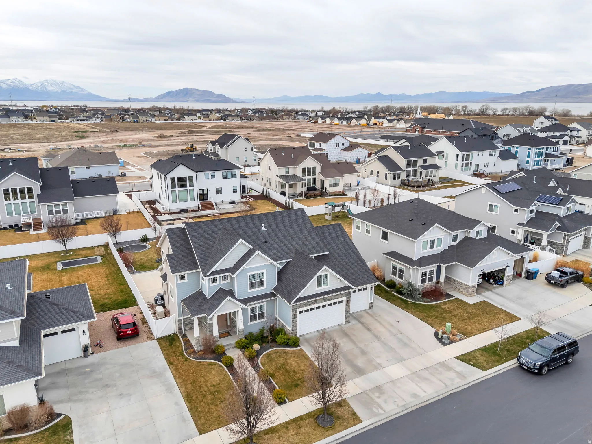 Aerial perspective of suburban area featuring a mountainous background