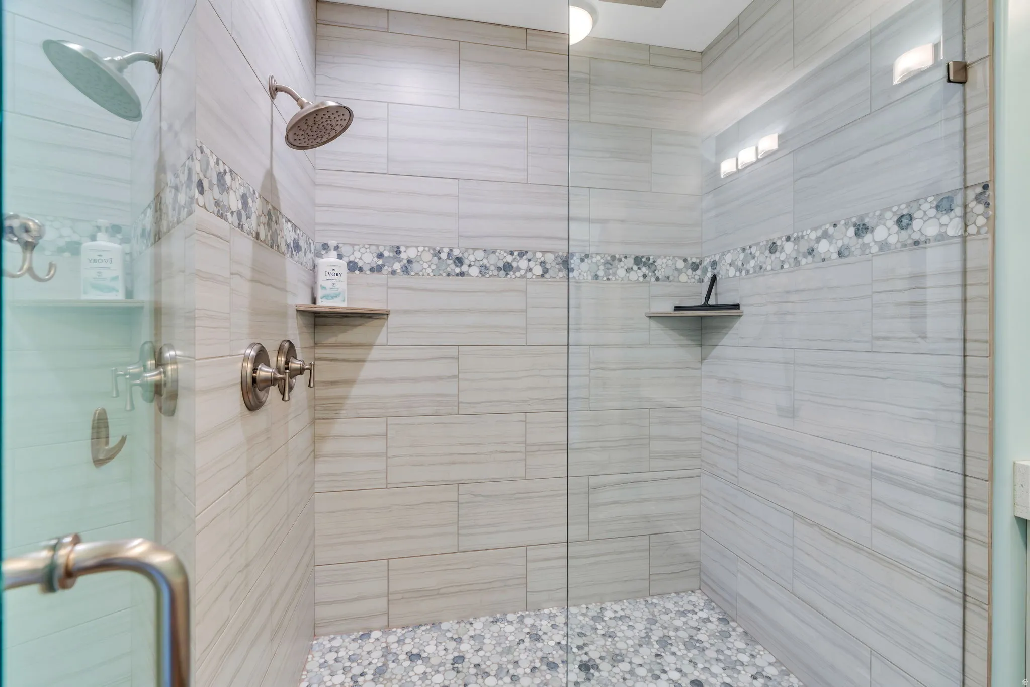 Full bath featuring a shower stall
