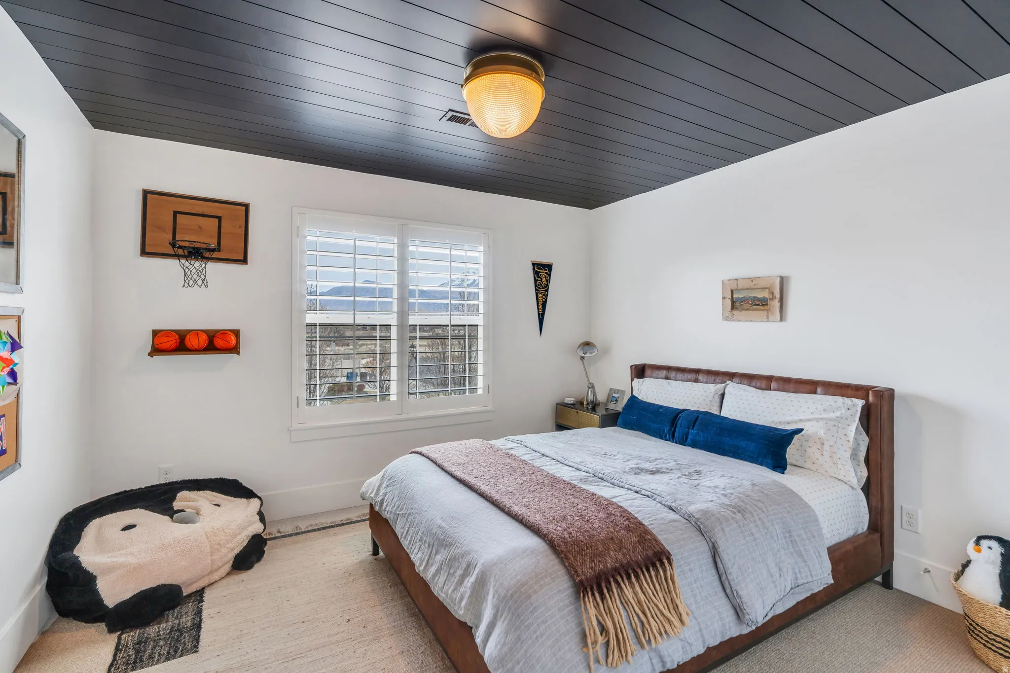 Bedroom featuring carpet floors and wood ceiling
