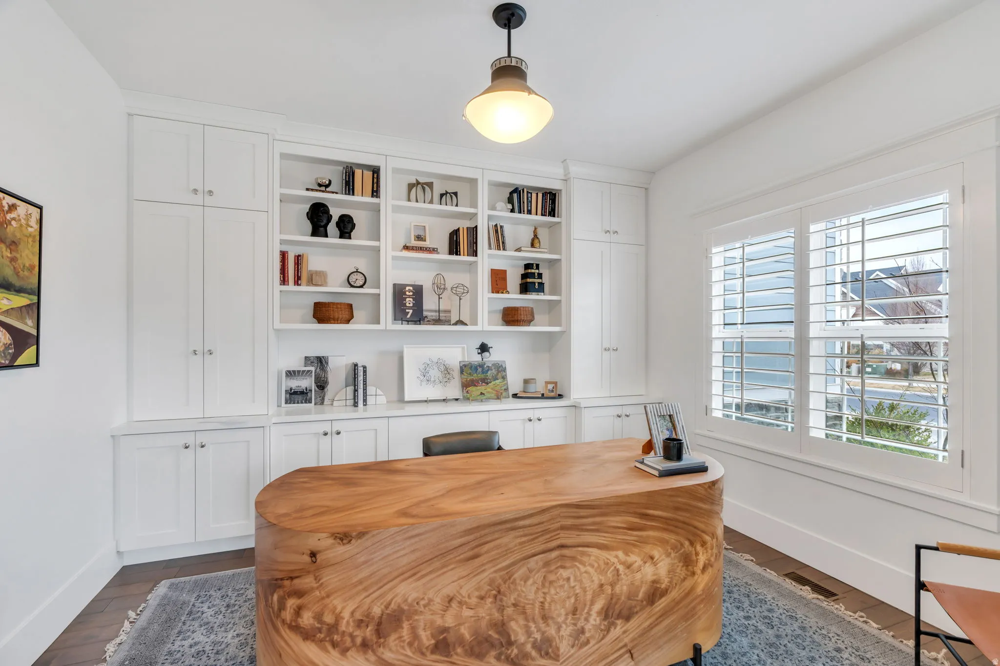Office space featuring dark wood-style floors