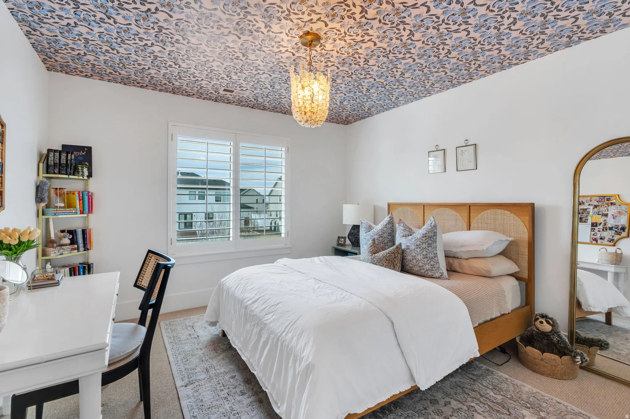 Bedroom featuring carpet floors and suspended lighting