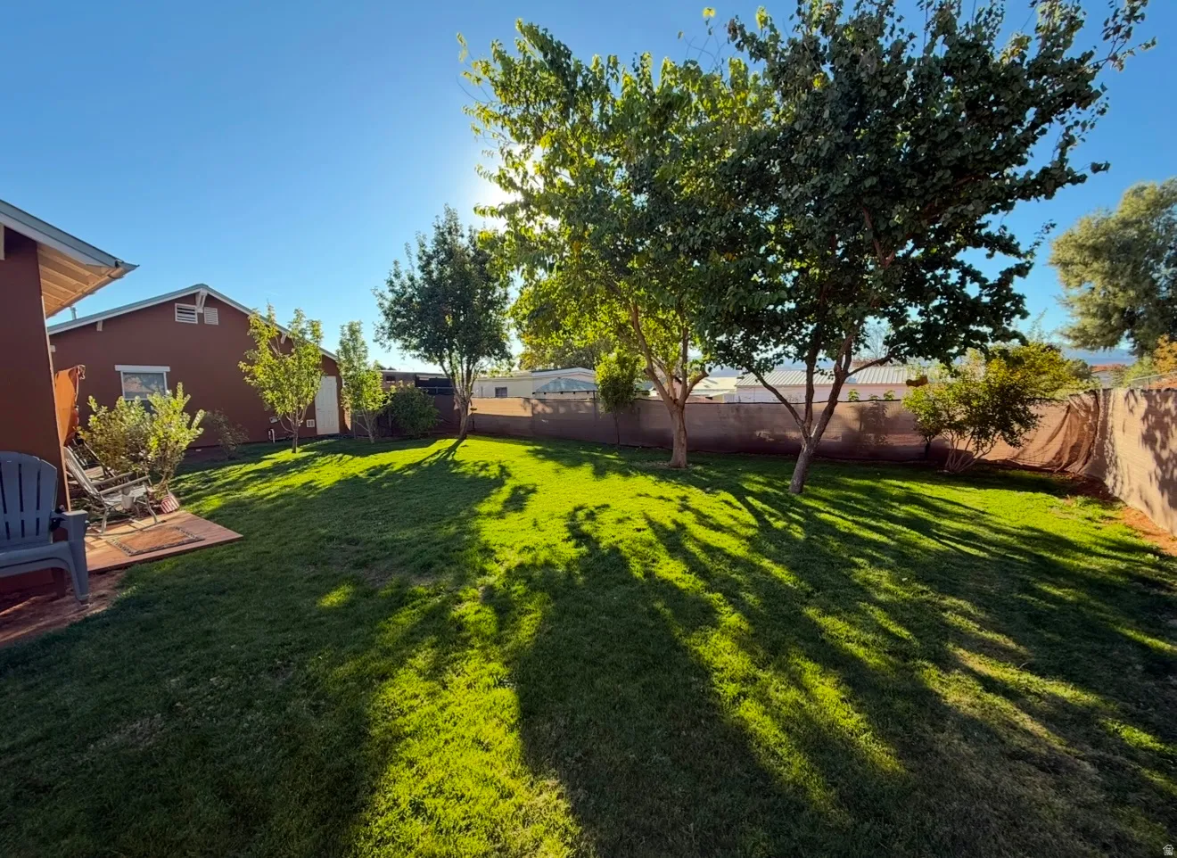 View of fenced backyard