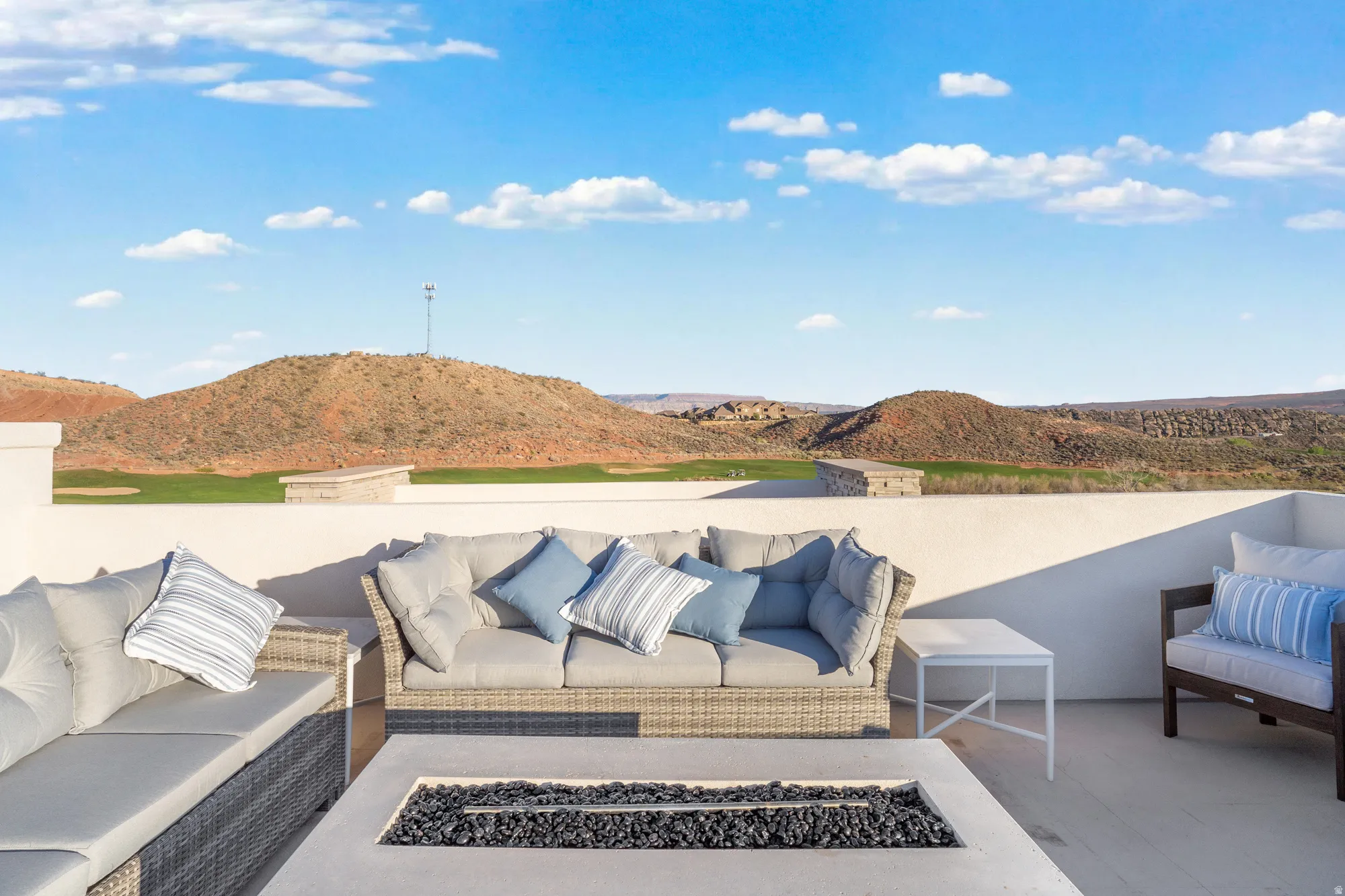 View of patio / terrace with a mountain view and an outdoor living space with a fire pit