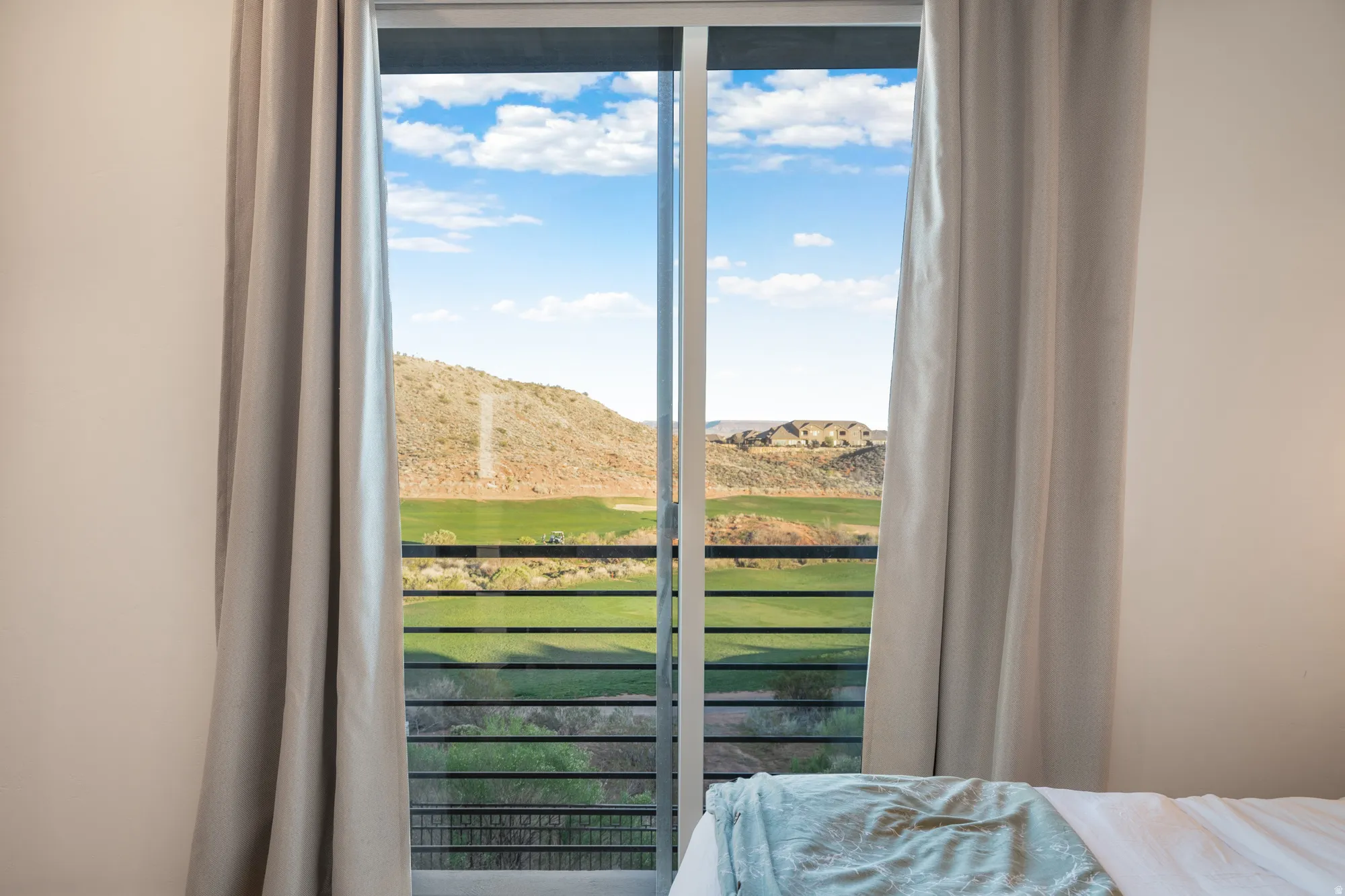 Bedroom featuring a mountain view and golf course view