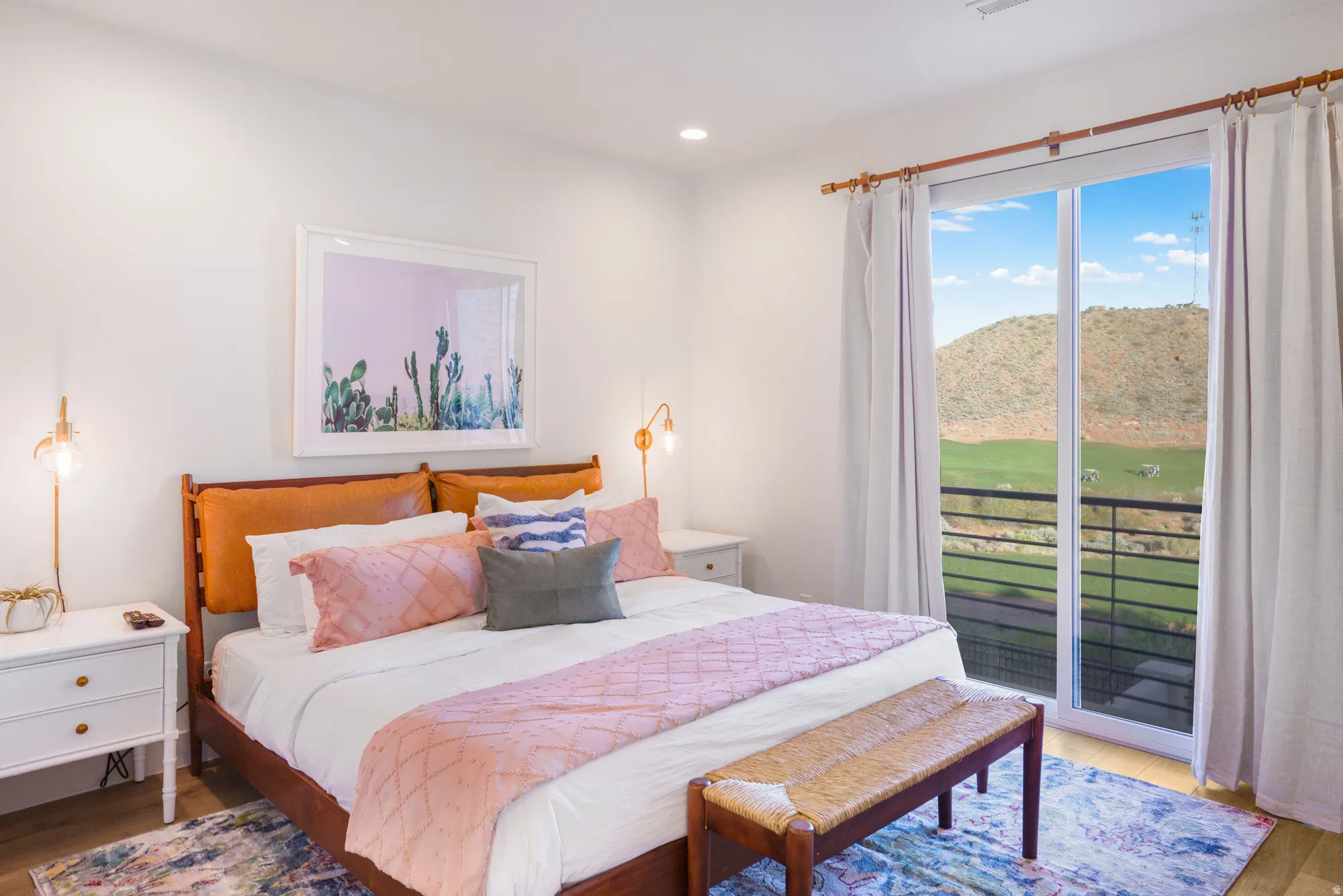Bedroom with wood finished floors, access to exterior, a mountain view, recessed lighting, and view of golf course