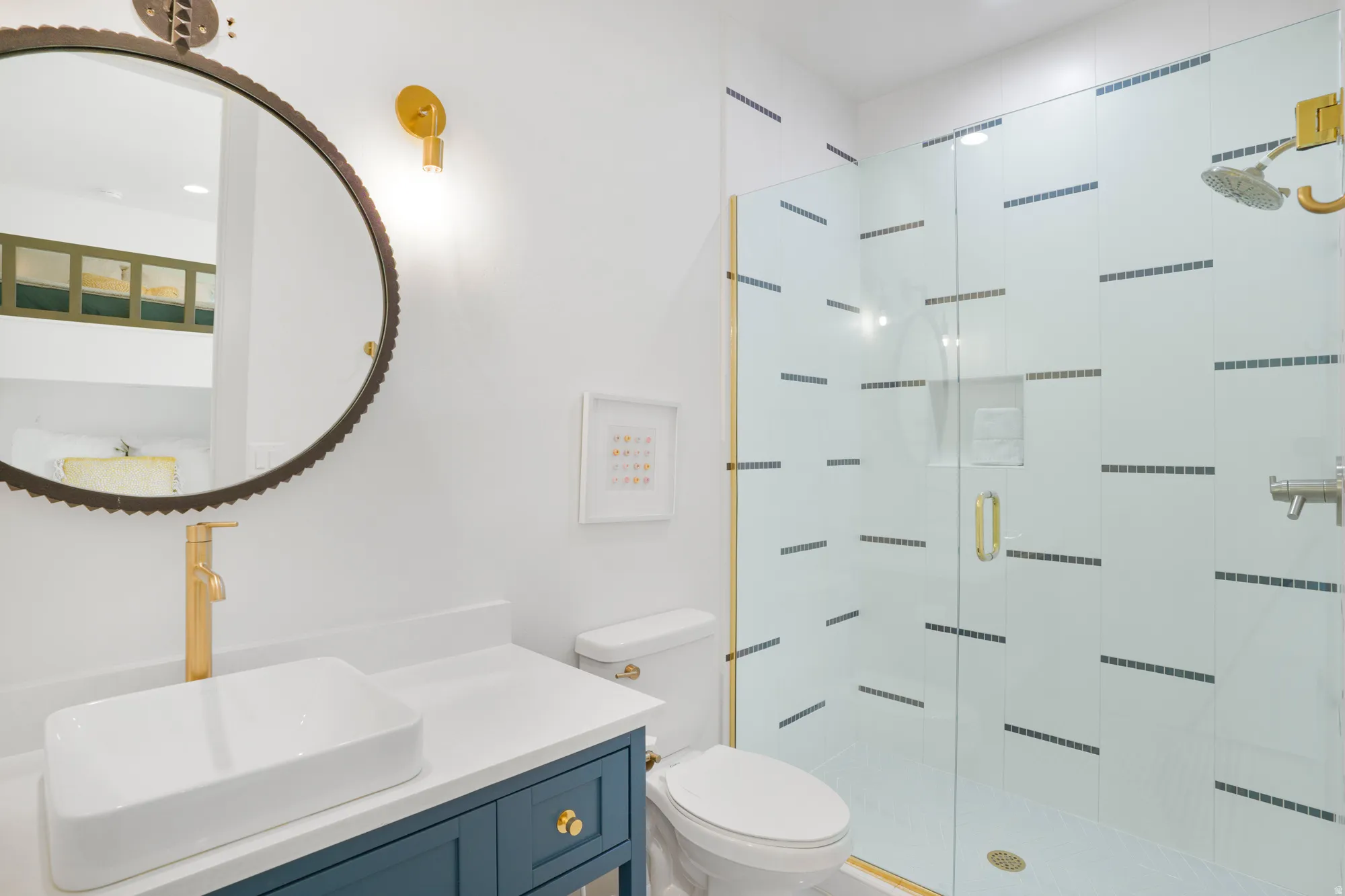 Bathroom featuring vanity, a shower stall, and recessed lighting